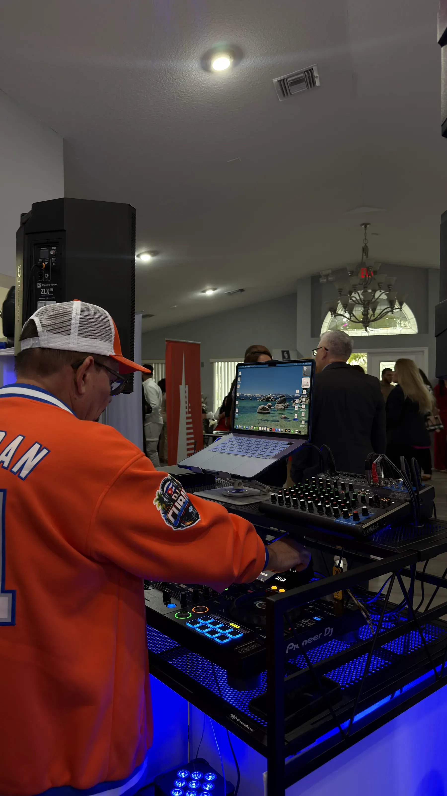 DJ Cuban working the booth, seen from behind